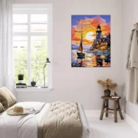 petit voilier et phare au coucher de soleil